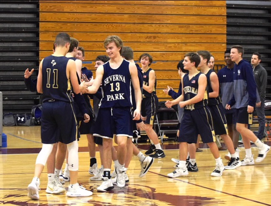 Anders Hansen greets Nick Carparelli after the falcons 37-33 win against Broadneck on February 15. The Falcons finished the season 14-7.  