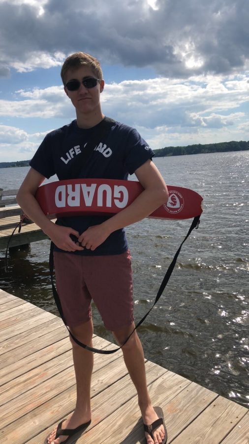Senior Bobby Davids patrols the Severn River as a lifeguard at Round Bay Main Beach. He maintained a confident and positive attitude all summer and made a bond with the recurring swimmers. “I do it for the kids who just want to love the water as much as I do,” Davids said.  