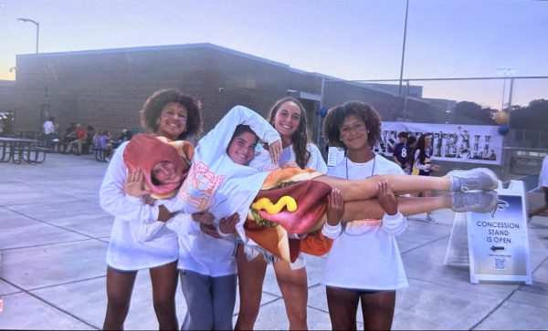 Students Ava Scott, Erin Hussey, Bella Van Gieson, Maria Bragg and Emerson Scott, pose for a picture during Best Buddies themed football game. The football game was at home against Glen Burnie, although the falcons lost 47-18, the fun of the theme and the fun of the game created a great atmosphere. 
