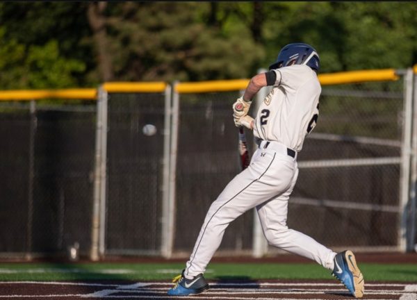 Senior Adam Clark playing the 2024 spring baseball season, representing Severna Park Falcons at the plate swinging with power. 