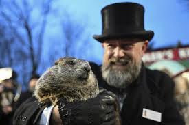 Groundhog Club handler A.J. Dereume hold Punxsutawney Phil during the 138th celebration. 