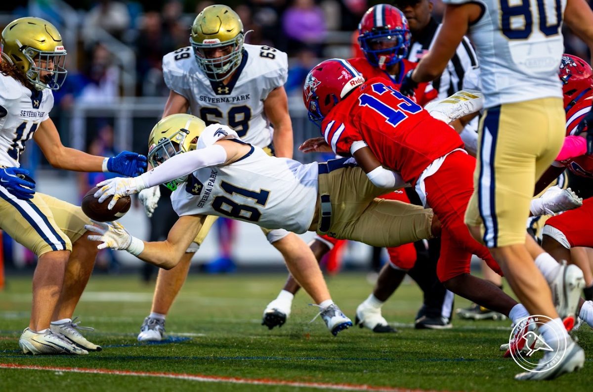 Severna Park No. 81 dives towards the extra yard against Old Mill for the win!