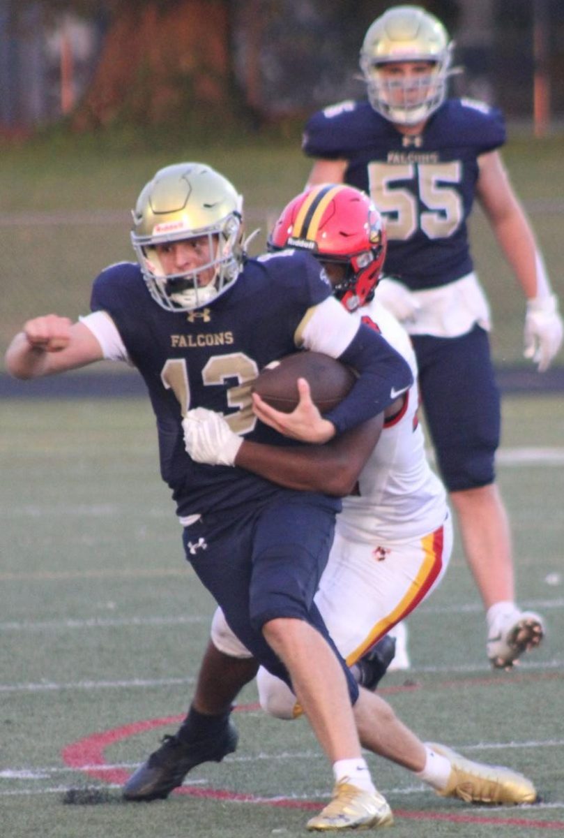 Quarterback Blake Howell running the ball on the September nineteenth  game vs Crofton. Blake is a senior and  new transfer this year from Archbishop Spalding making a huge change to the Falcons success on the field.