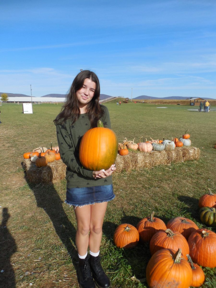 At Magnolia Meadow farms Ella Stoudt is seen with a pumpkin in her hand. You can pick pumpkins at the pumpkin patch, or they have buckets of them at the front entrance. The pumpkins come in all different shapes and sizes.