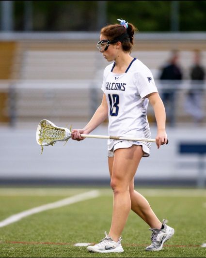 Three sport athlete Taylor Edwards playing her spring sport, lacrosse. Edwards joined varsity lacrosse in her sophomore year, after completing a successful freshman year on the junior varsity team. Edwards has completed soccer and lacrosse seasons, as well as ran track. “I love being in an environment where everyone is working hard and having fun” 
