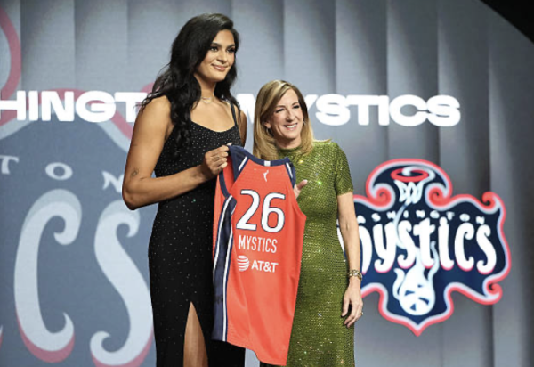 UCLA’s Lauren Betts poses with WNBA commissioner Cathy Engelbert and holds up a Washington Mystics jersey. Upcoming games for the Mystics include an away game against the Toronto Tempo on May 8, followed by the first home game on May 10 against New York Liberty.
