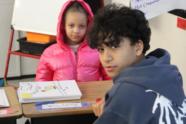 Junior Adrian Mesa at Brooklyn Park Elementary on March 27 to deliver his children's book to his buddy.