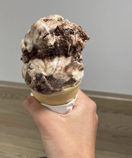 A customer orders a cone of salted caramel brownie batter ice cream on a visit with their family. This ice cream is known to be salty and melty and is usually served in a cup. This is a popular flavor because it boasts many different flavors.